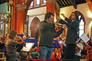 Magnus Johnston rehearsing with the orchestra